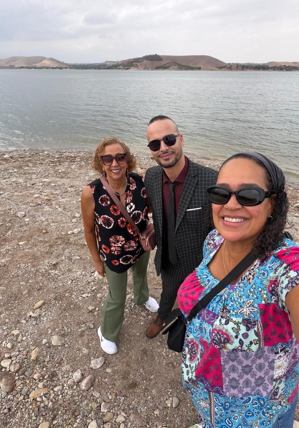 Morocco Open Road driver-guide with guests by a lake in Morocco